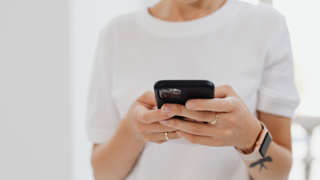 Woman holding phone and texting